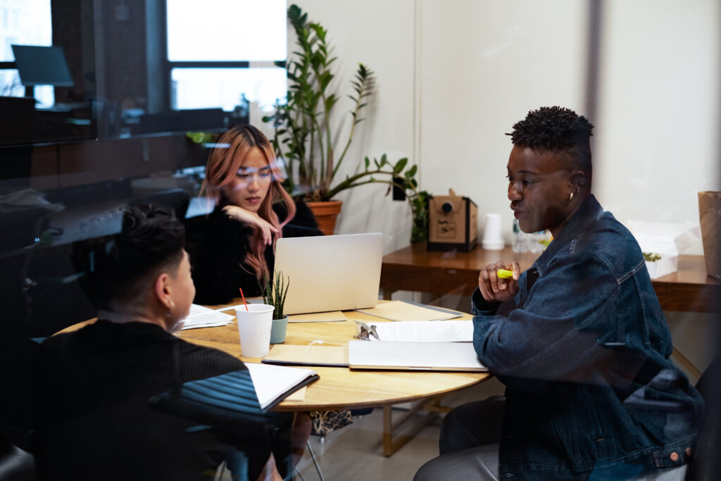 LGBTQ+ business owners and entrepreneurs working together on finding marketing resources for LGBTQ+ owned businesses