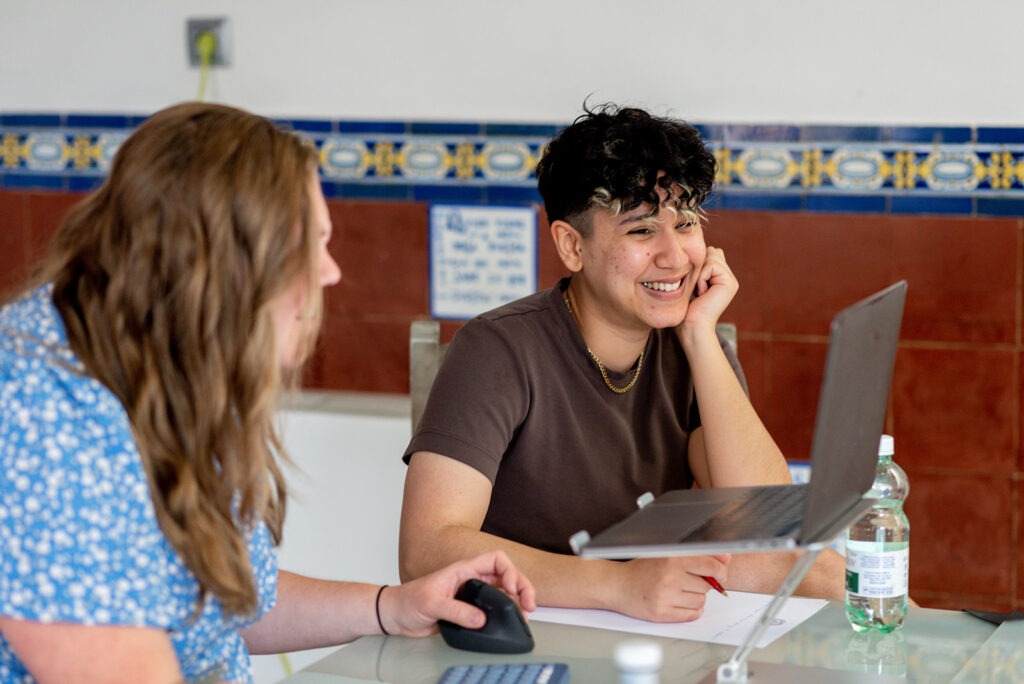 Marketing by Rocio founder and marketing expert for LGBTQ+ owned small businesses Rocio Sanchez in a meeting talking about how to create a marketing plan as a small queer-owned business