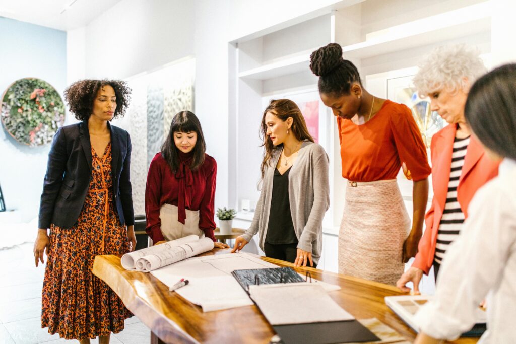 Team collaborating in a diverse and inclusive workplace, highlighting LGBTQ+ inclusion, workplace diversity, and cultural awareness.