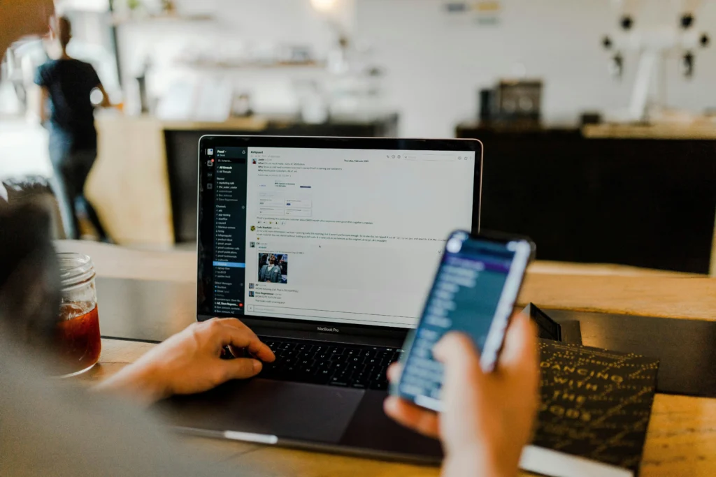 Business owner checking website user interface and SEO settings on laptop screen