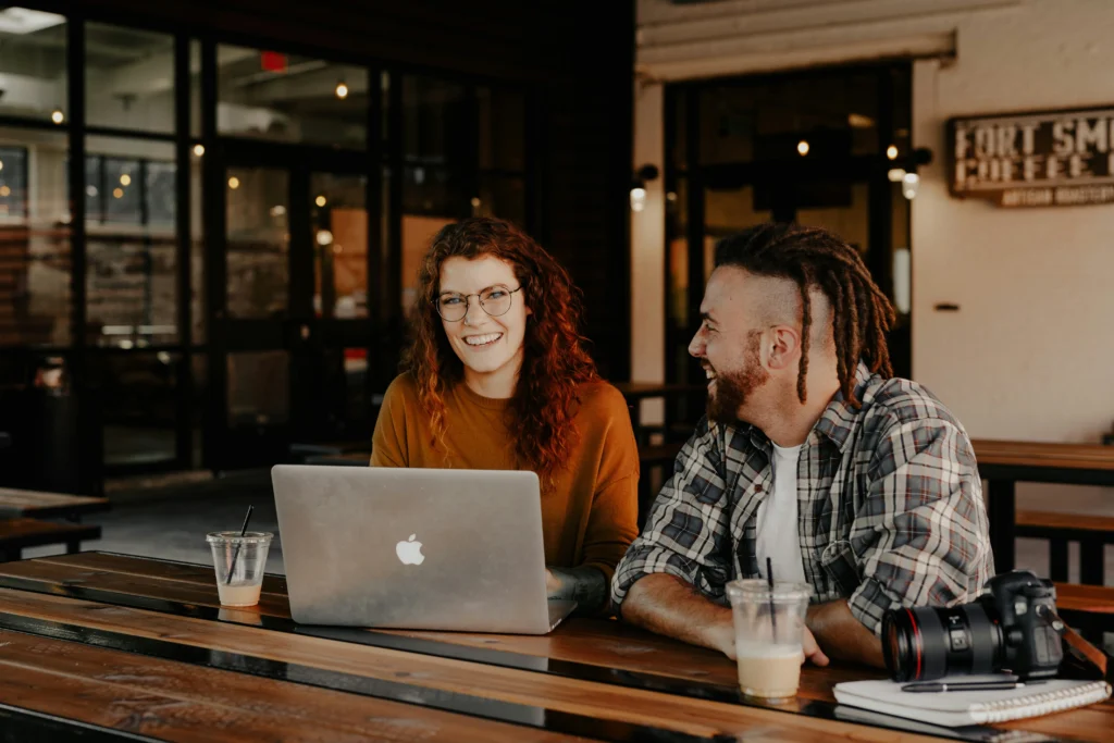 Delighted young professionals at a café working out their SEO strategy