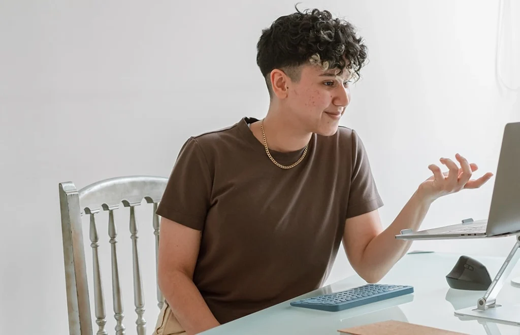 Marketing by Rocio founder and SEO expert looking at a laptop