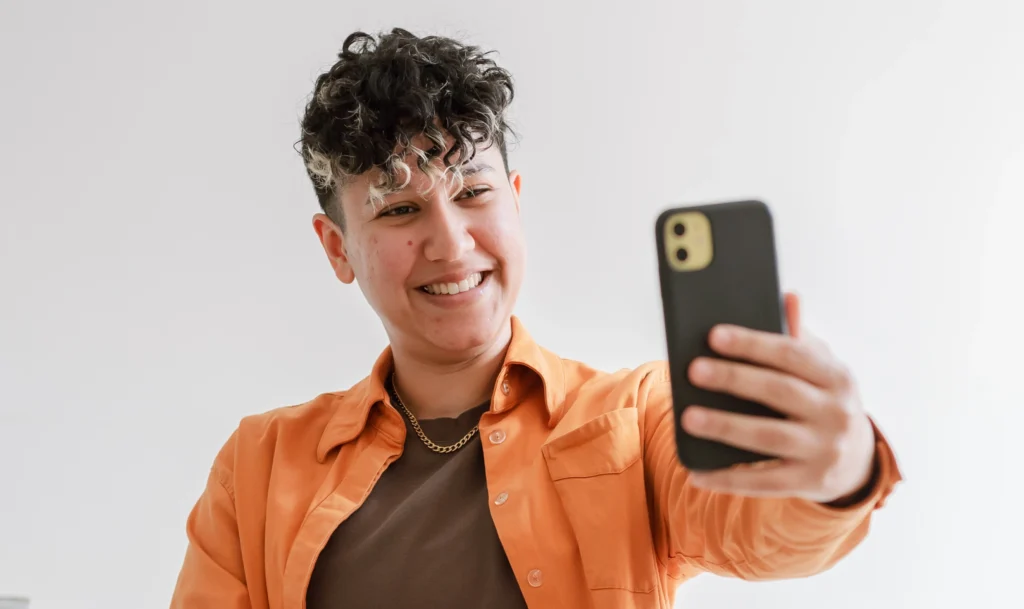 Marketing by Rocio founder smiling for a selfie photo.