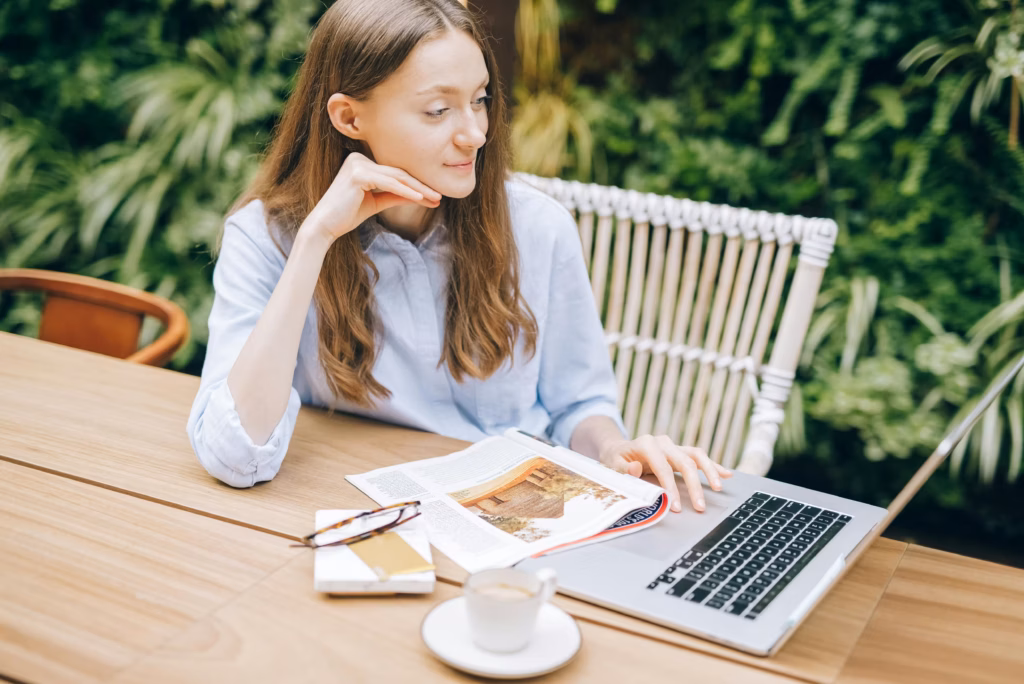 Business owner optimizing her website’s structure and content by choosing through SEO strategies.