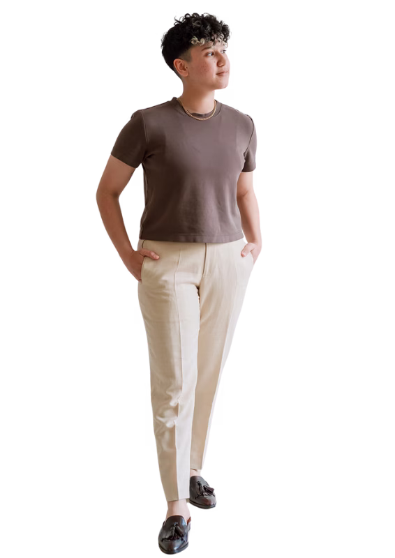 Rocio Sanchez, LGBT digital marketing agency owner, standing confidently in professional attire.
