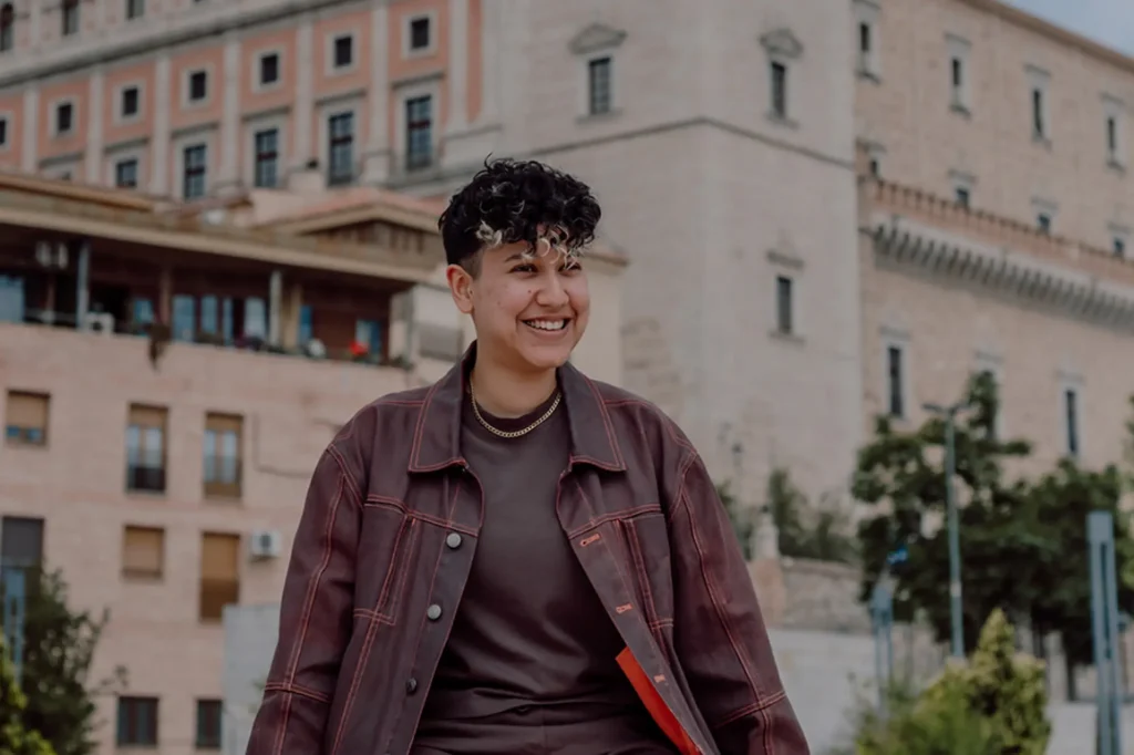 Marketing by Rocio founder smiling outdoors, representing approachable and authentic small business marketing and blogging advice