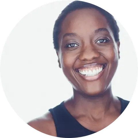 Adobuere Ebiama, Creative Producer of Black and Worldly, smiling in front of a white background.