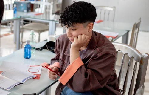 Rocio Sanchez, marketing strategist, thinking at a table