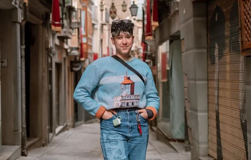 Rocio Sanchez, standing confidently on a street in Spain.